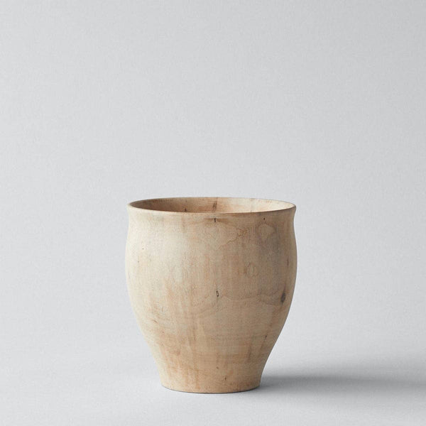 Wooden vase on a light gray background