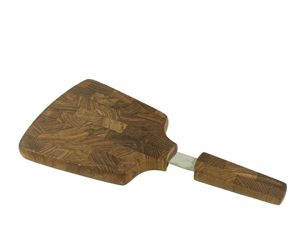 Wooden cutting board with a textured surface on a white background