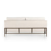 Modern white sofa with metal frame on a white background