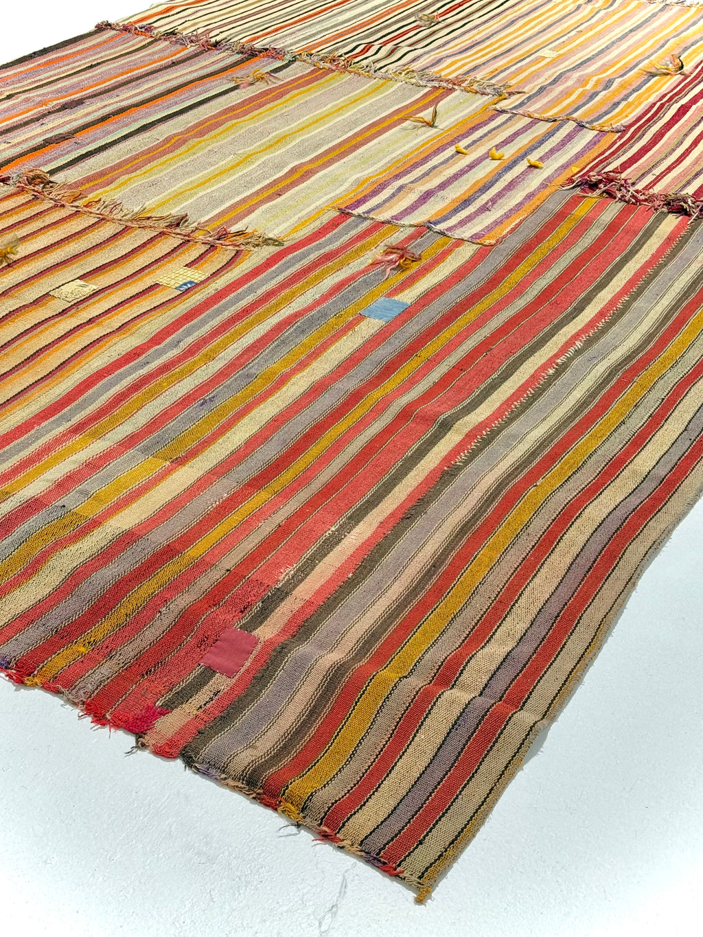 Striped fabric with multicolor pattern on a white background