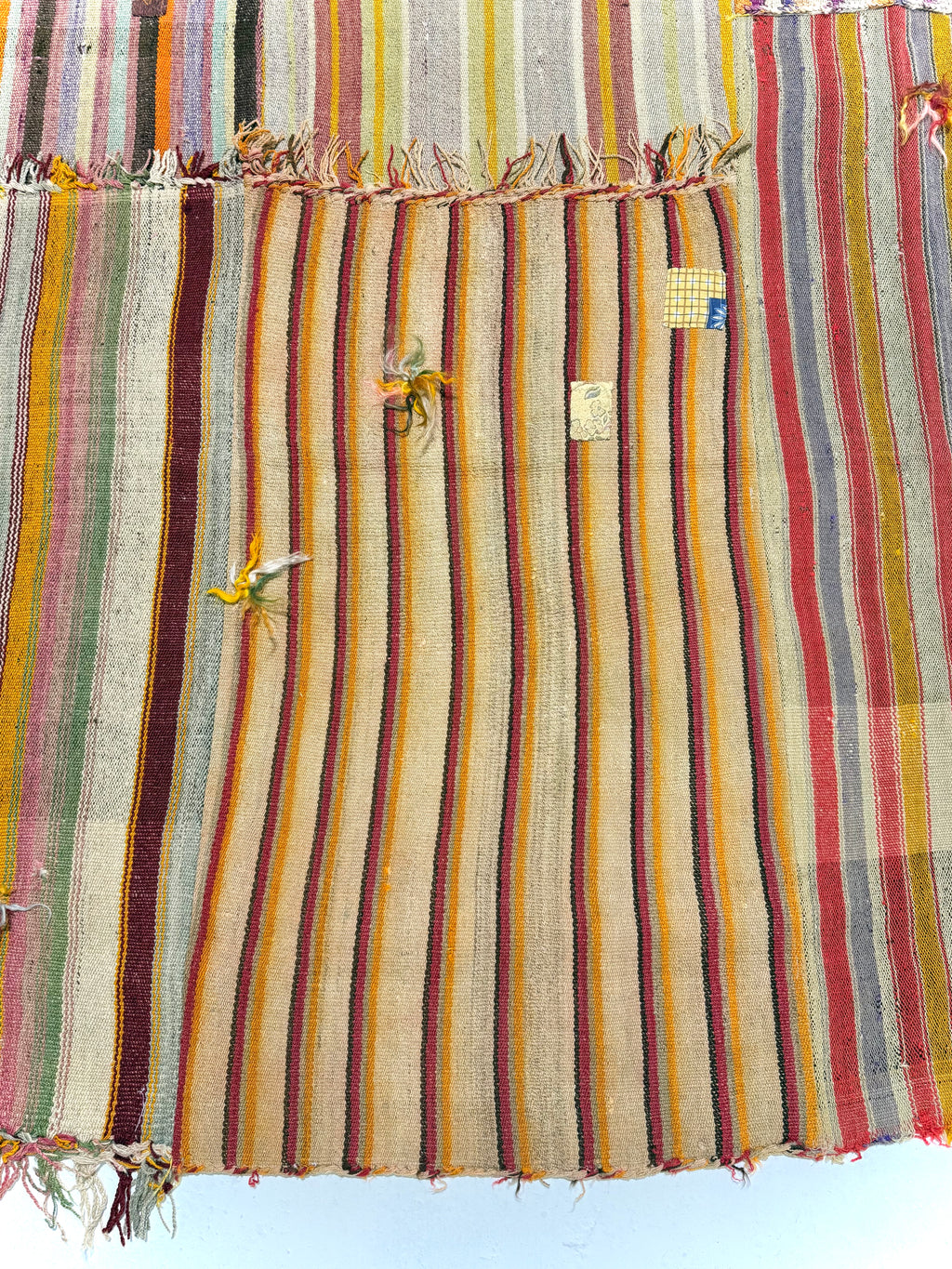 Striped rug with colorful patterns on a white background