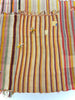 Striped rug with colorful patterns on a white background