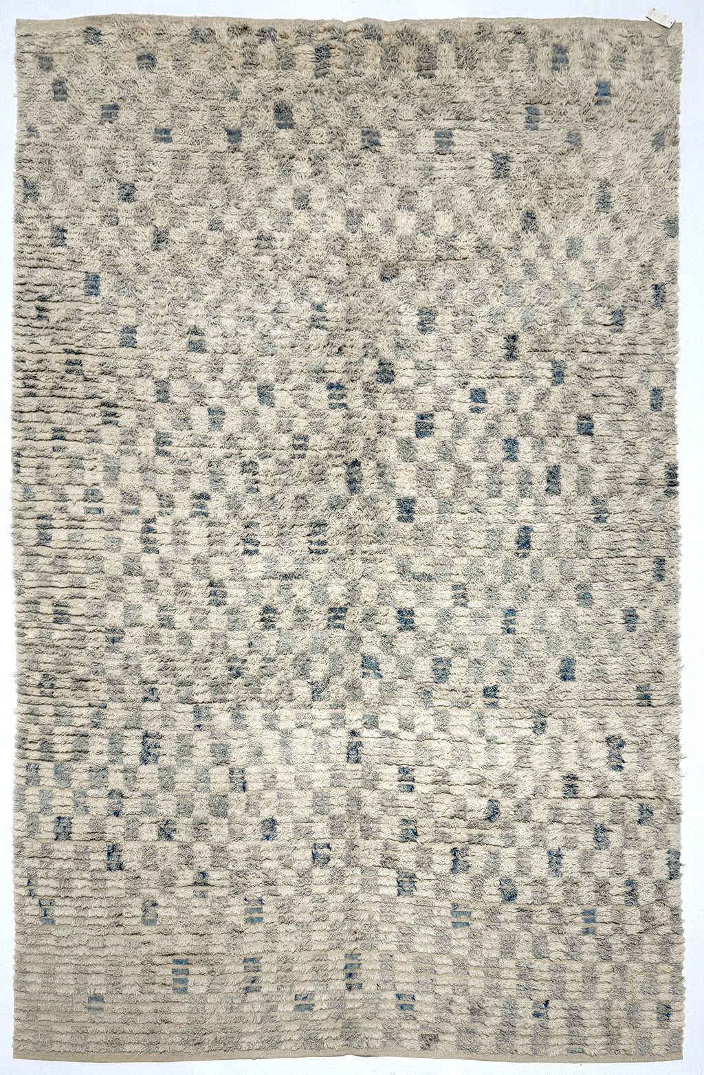 Textured area rug with a geometric pattern in neutral tones