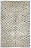 Textured area rug with a geometric pattern in neutral tones